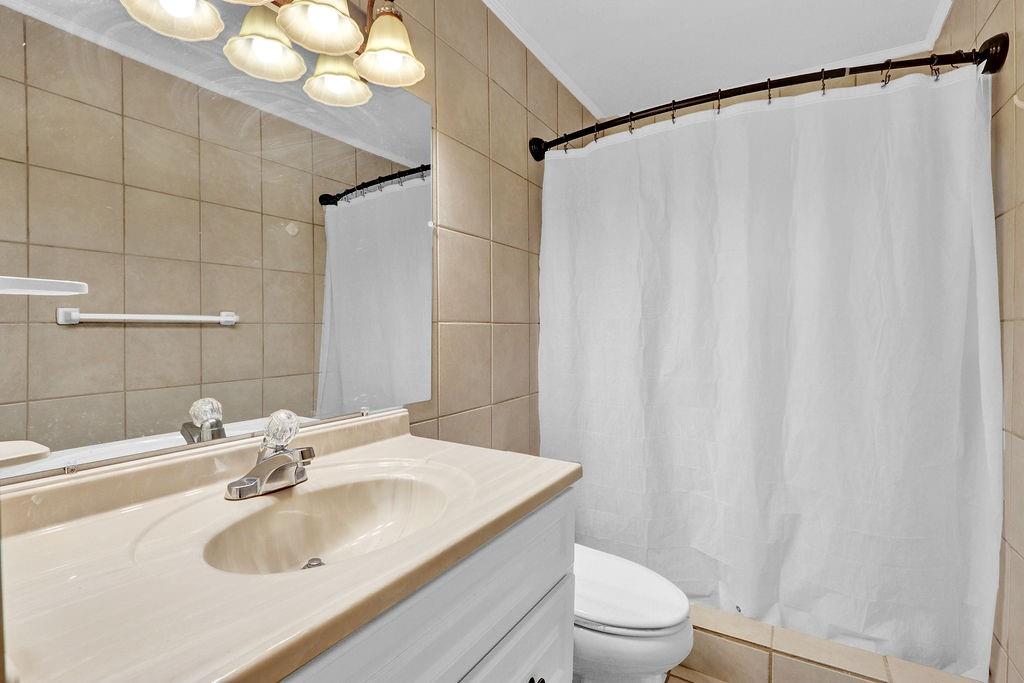 5636 River Stone Road Gainesville, GA 30506 - Photo 27 of 36 a bathroom with a sink and a mirror