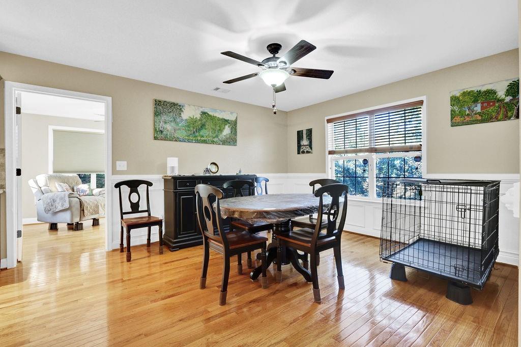5636 River Stone Road Gainesville, GA 30506 - Photo 7 of 36 a view of a dining room with furniture window and wooden floor