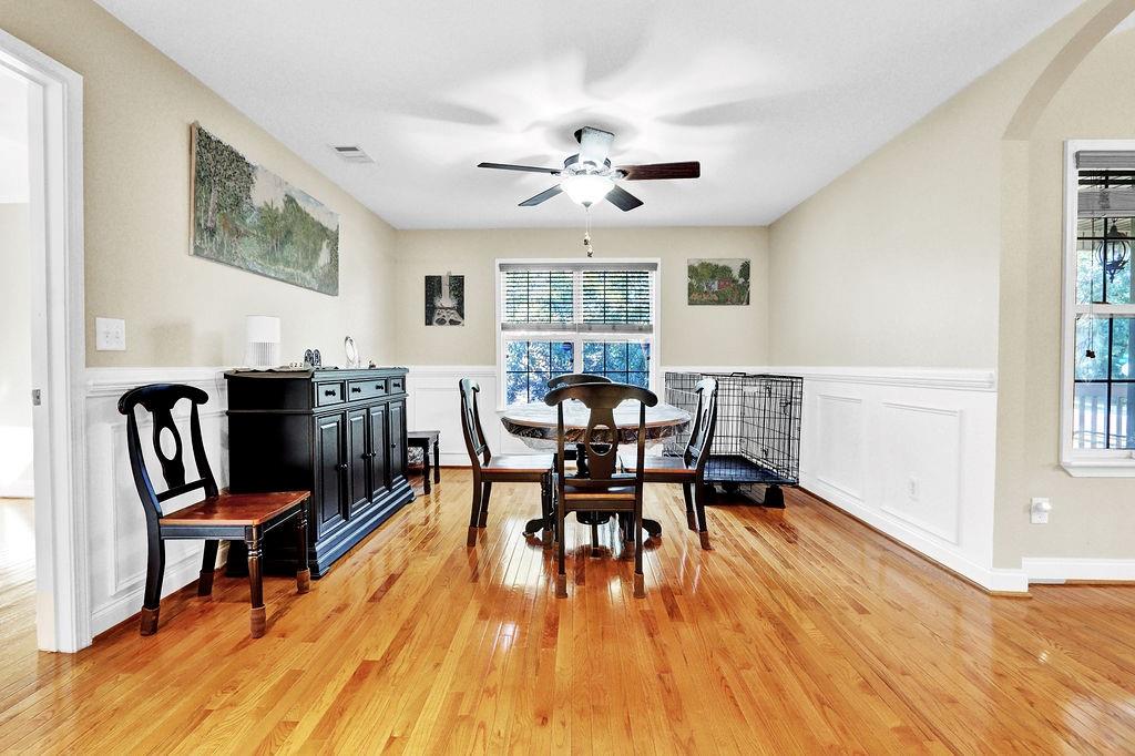 5636 River Stone Road Gainesville, GA 30506 - Photo 8 of 36 a view of a dining room with furniture window and wooden floor