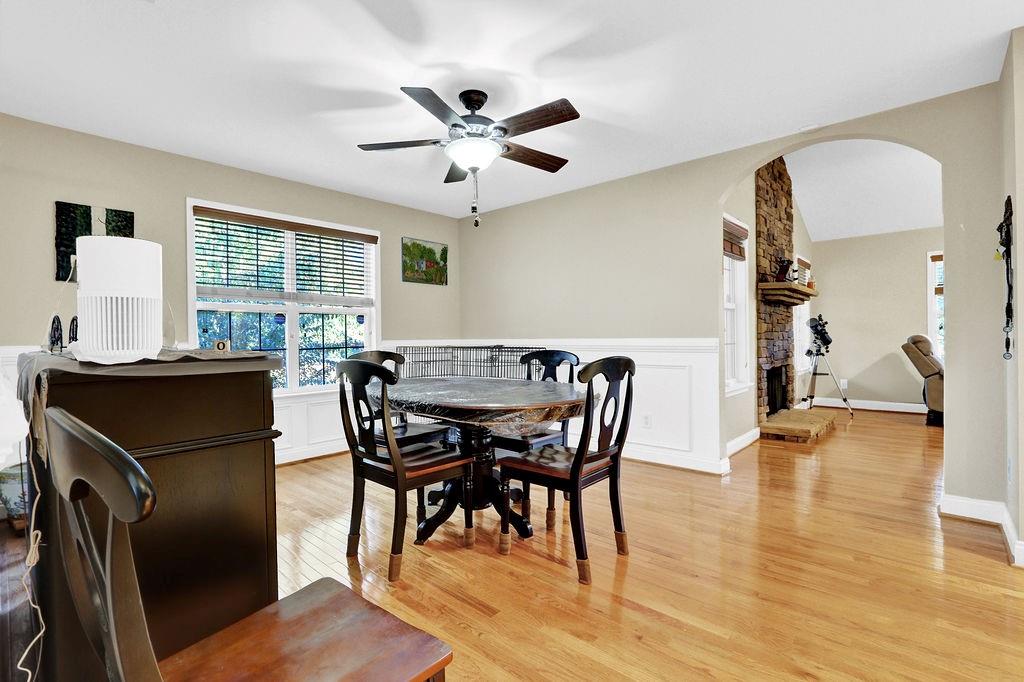 5636 River Stone Road Gainesville, GA 30506 - Photo 9 of 36 a view of a dining room with furniture and wooden floor