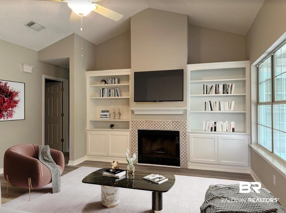 1512 North Cedar Street Foley, AL 36535 - Photo 3 of 13 Living room featuring light hardwood / wood-style floors, lofted ceiling, ceiling fan, and a tile fireplace