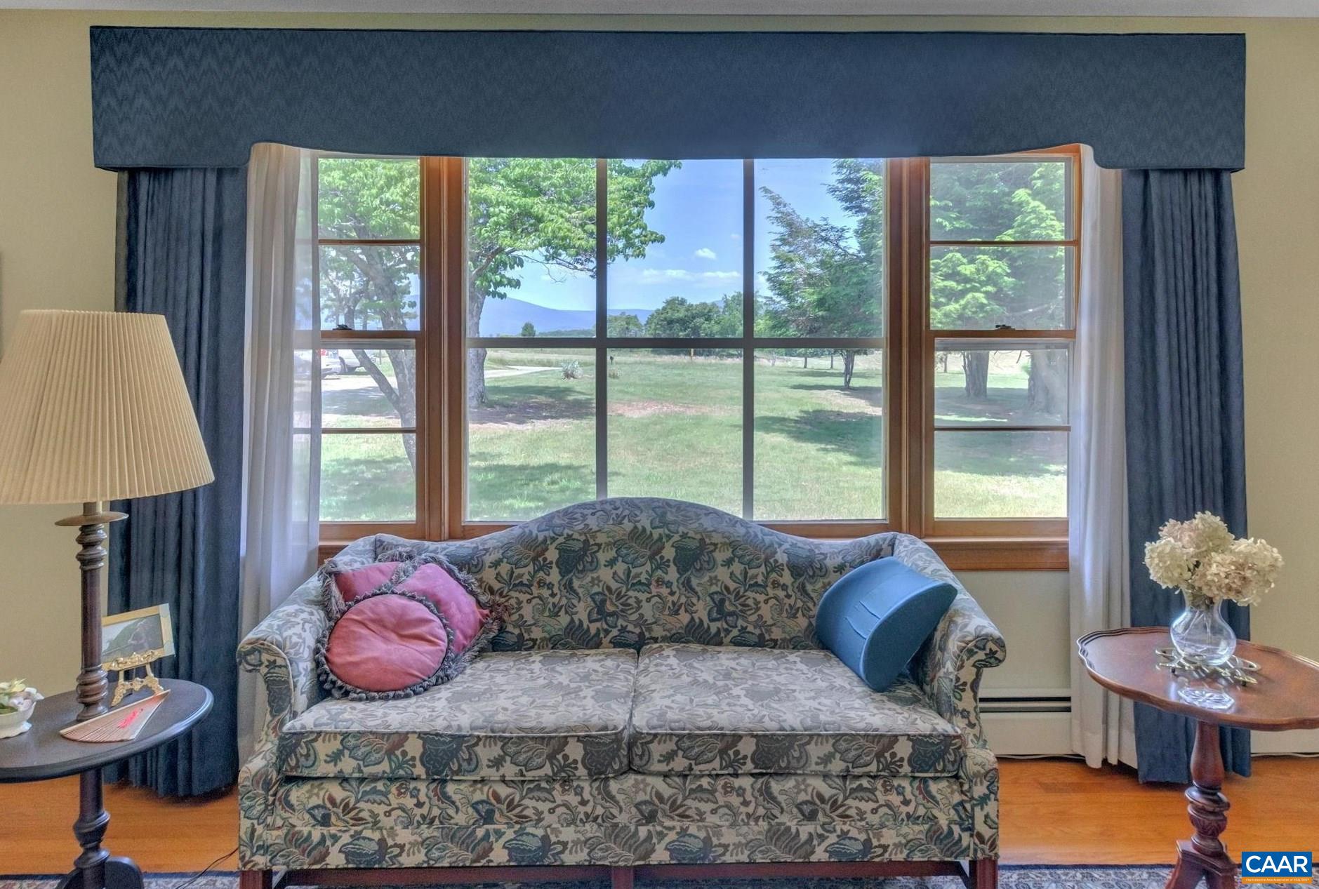 4459 Garth Road Charlottesville, VA 22901 - Photo 14 of 54 a living room with furniture and a large window