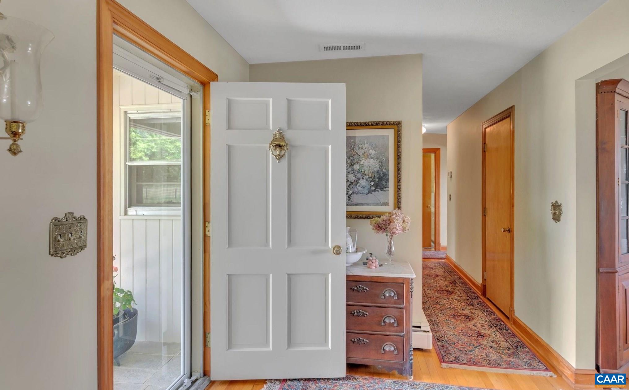 4459 Garth Road Charlottesville, VA 22901 - Photo 15 of 54 a view of a hallway with wooden floor and front door