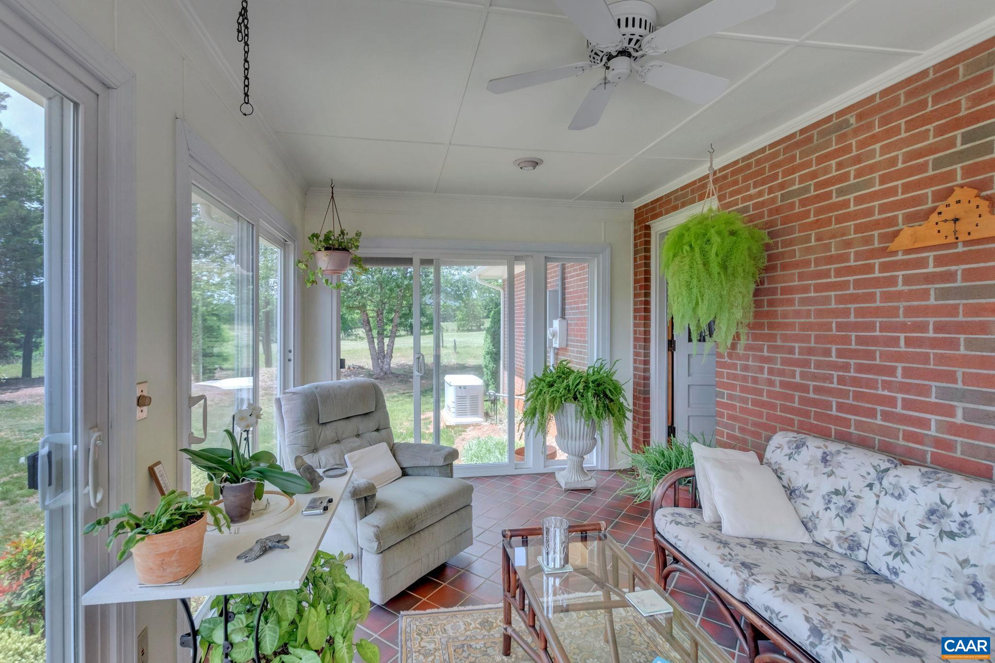 4459 Garth Road Charlottesville, VA 22901 - Photo 28 of 54 a living room with furniture and a potted plant