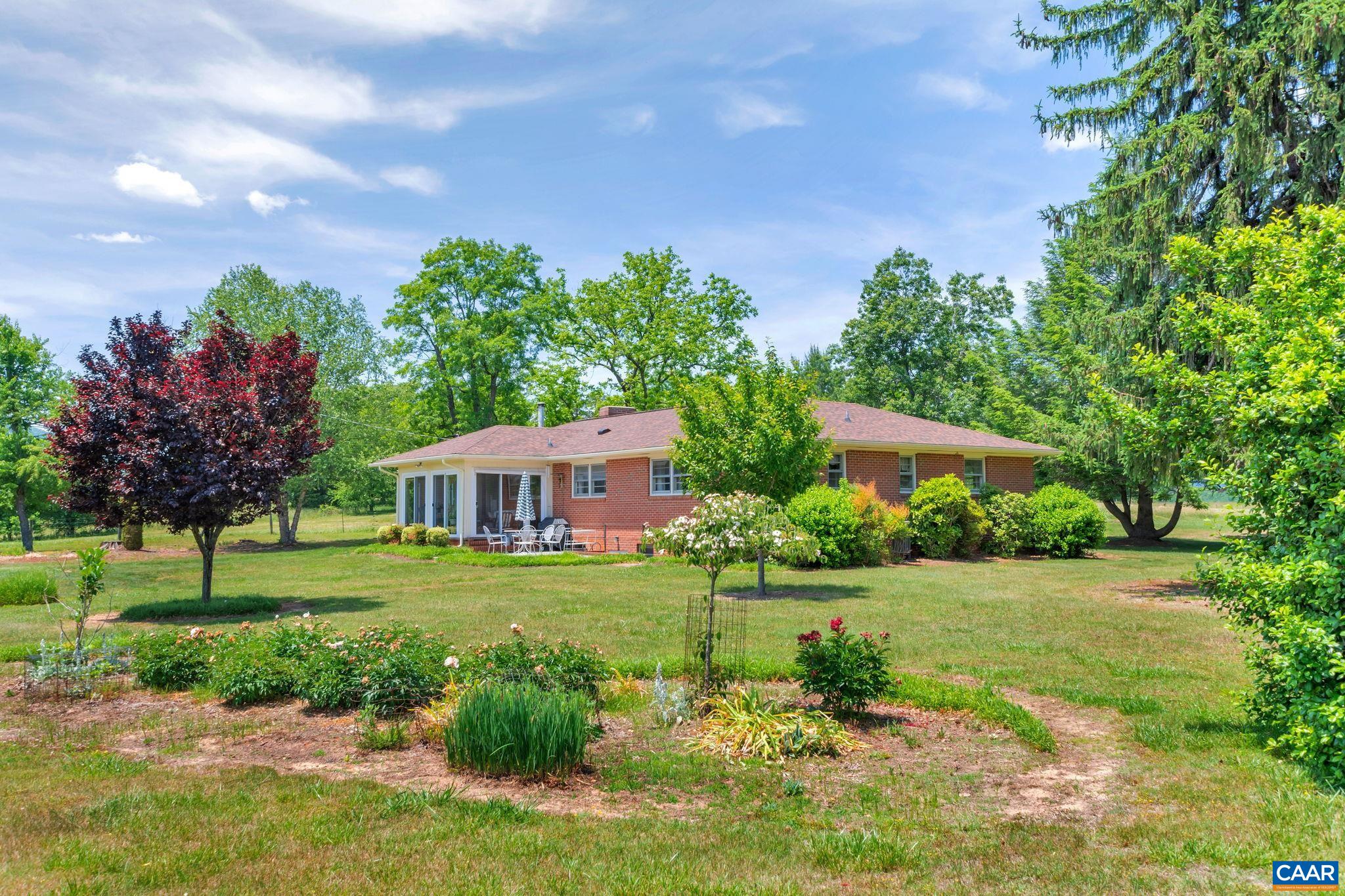 4459 Garth Road Charlottesville, VA 22901 - Photo 44 of 54 a front view of a house with garden
