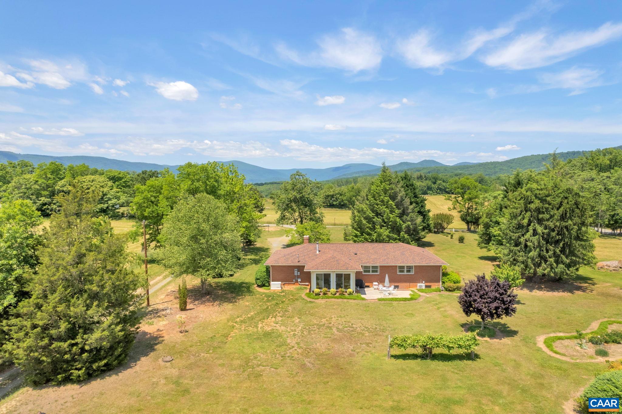 4459 Garth Road Charlottesville, VA 22901 - Photo 45 of 54 a view of a garden with a building in the background