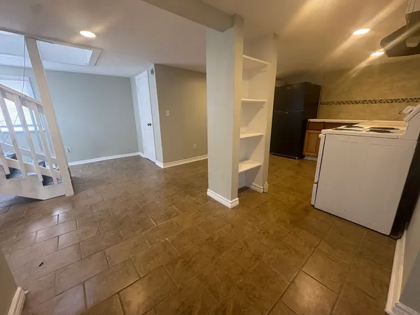 a view of a storage & utility room with a sink