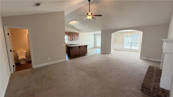 a view of livingroom with hardwood floor and a ceiling fan
