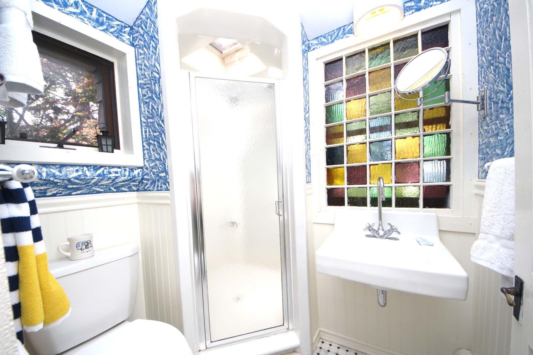 15 Ensign Road Rowayton, CT 06853 - Photo 17 of 21 a bathroom with a sink a toilet and shower curtain