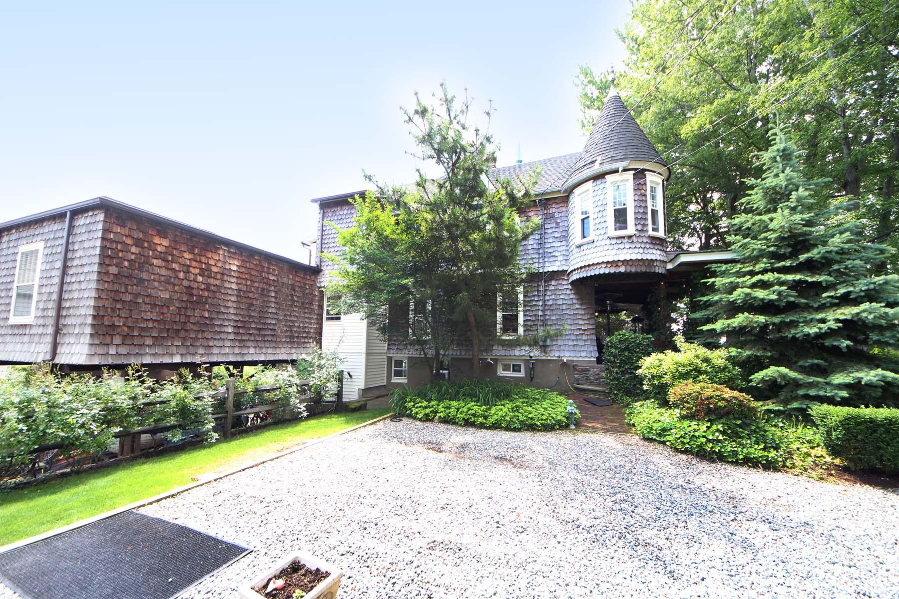 15 Ensign Road Rowayton, CT 06853 - Photo 2 of 21 a front view of a house with a garden and plants