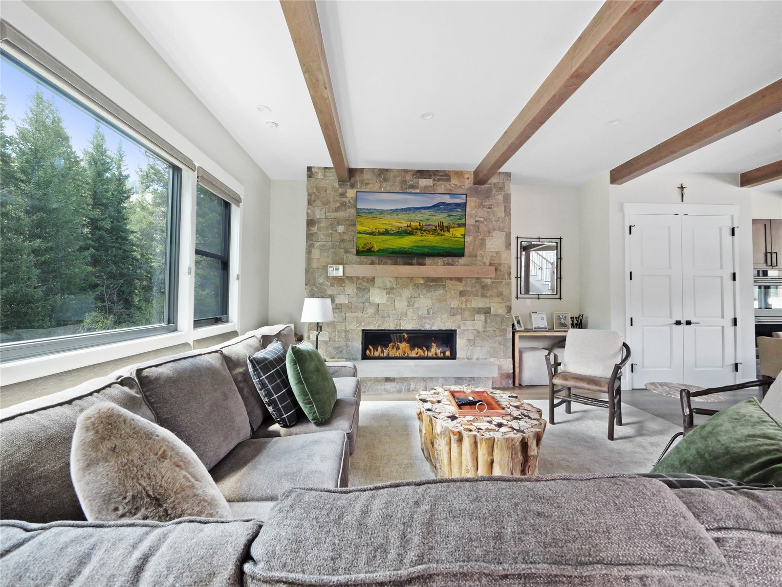 75 Alcove Court, Unit 75 Keystone, CO 80435 - Photo 29 of 40 a living room with furniture fireplace and a large window
