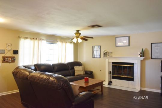 321 East Wilson Avenue Ridgecrest, CA 93555 - Photo 2 of 16 a living room with furniture and a fireplace