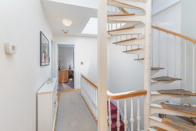 a view of a hallway with staircase