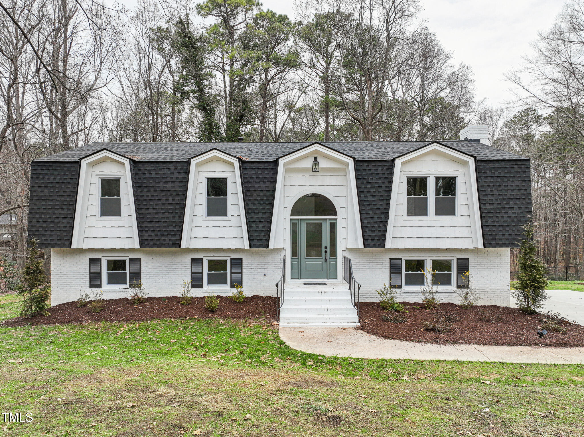 front view of a house with a yard