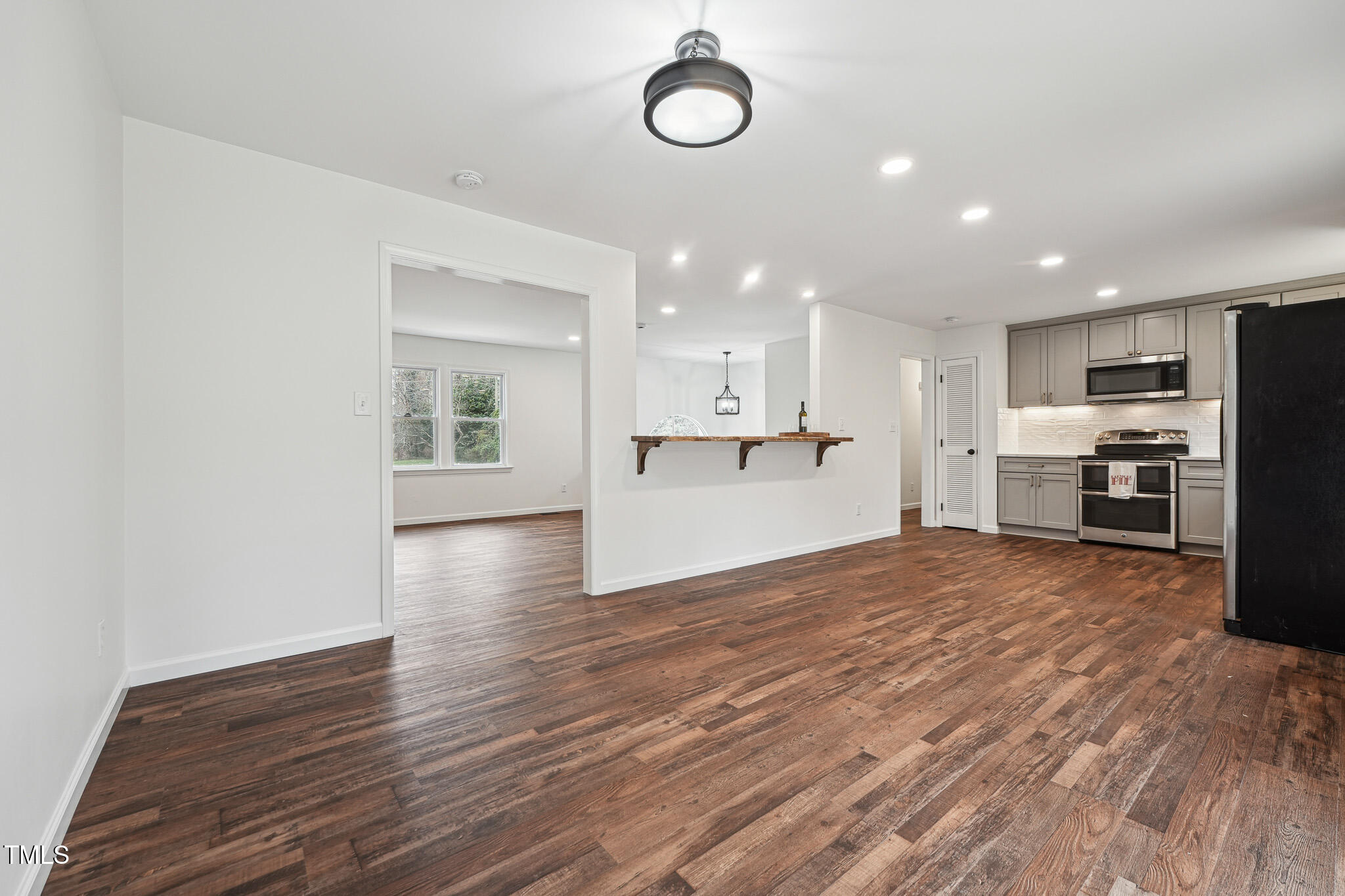 109 Chatterson Drive Raleigh, NC 27615 - Photo 10 of 51 a view of kitchen with stove and wooden cabinets