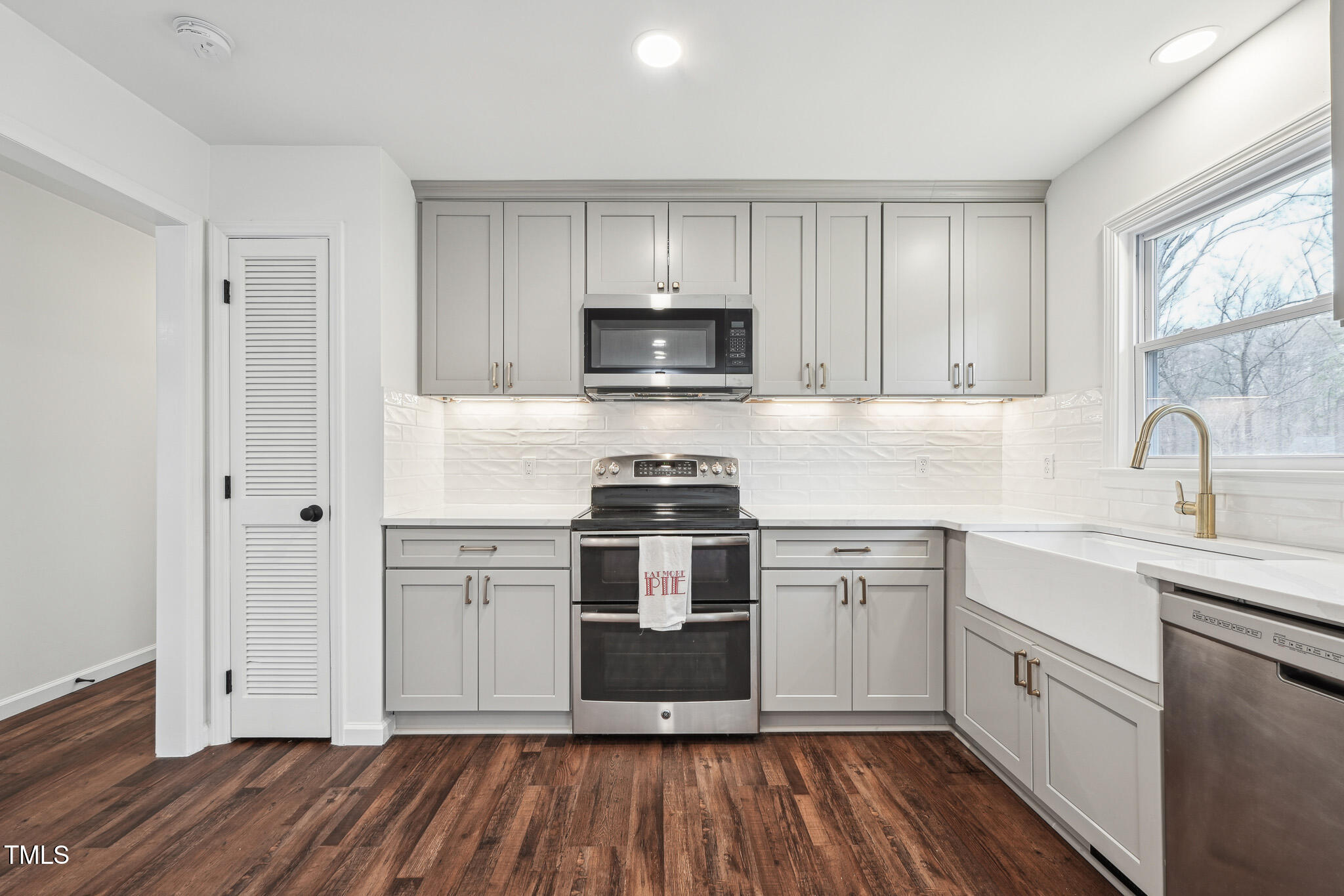 109 Chatterson Drive Raleigh, NC 27615 - Photo 15 of 51 a kitchen with a sink cabinets and stainless steel appliances