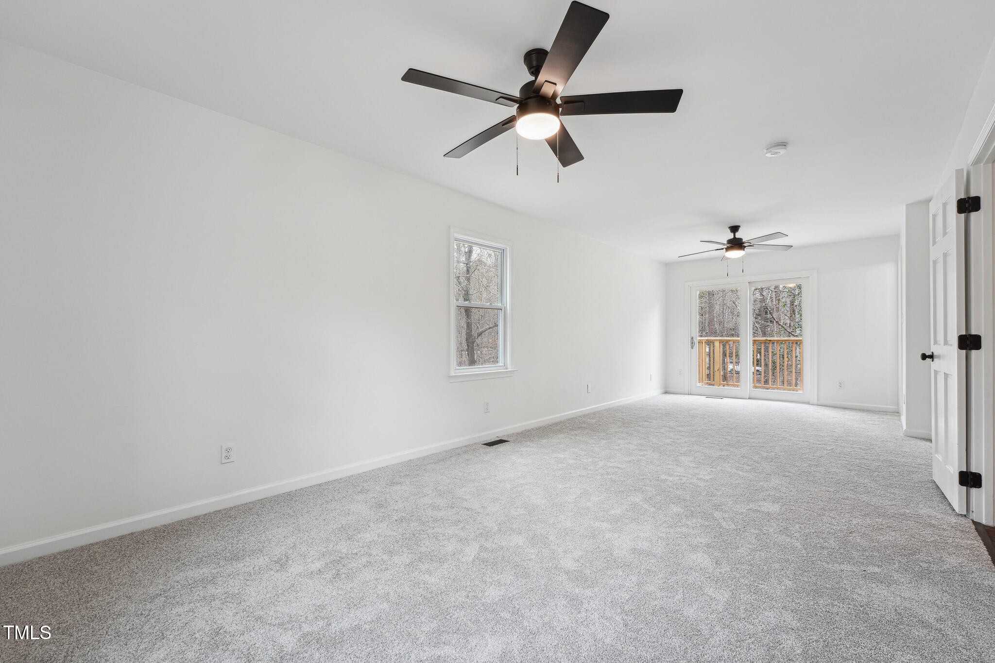 109 Chatterson Drive Raleigh, NC 27615 - Photo 18 of 51 en empty room with windows and ceiling fan