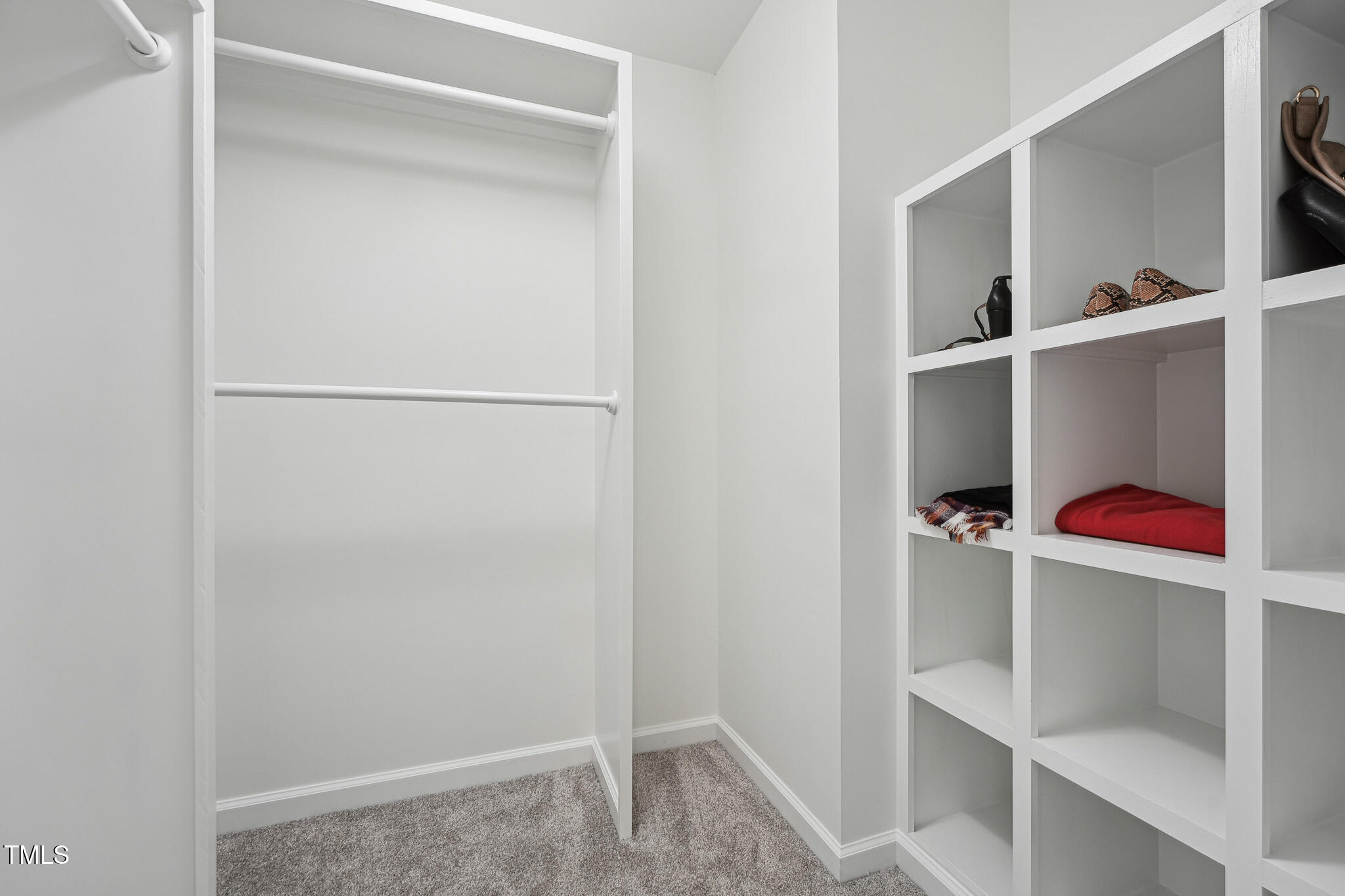 109 Chatterson Drive Raleigh, NC 27615 - Photo 22 of 51 a room with a closet and wooden floor