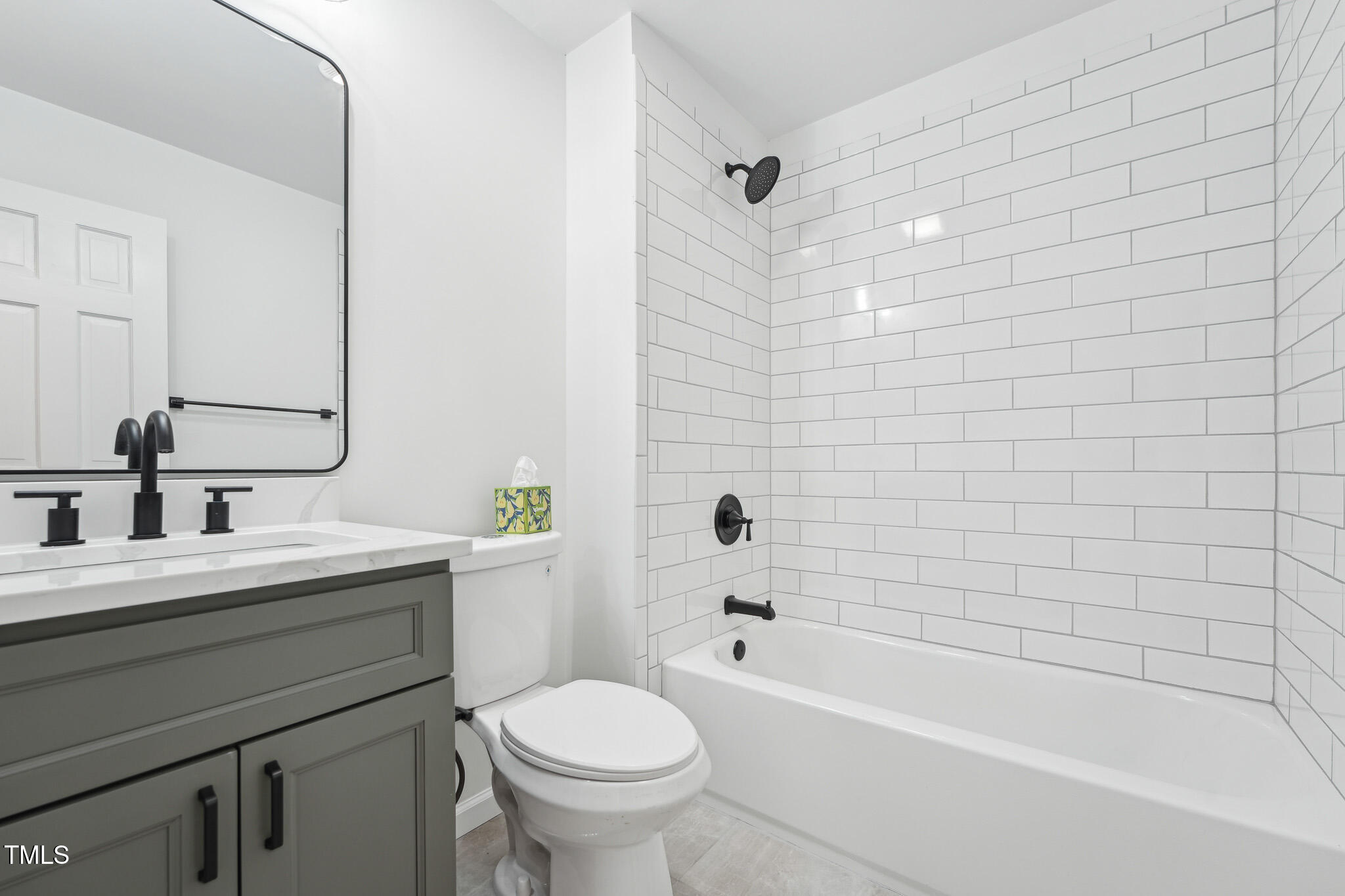 109 Chatterson Drive Raleigh, NC 27615 - Photo 26 of 51 a bathroom with a bathtub shower sink vanity mirror and toilet