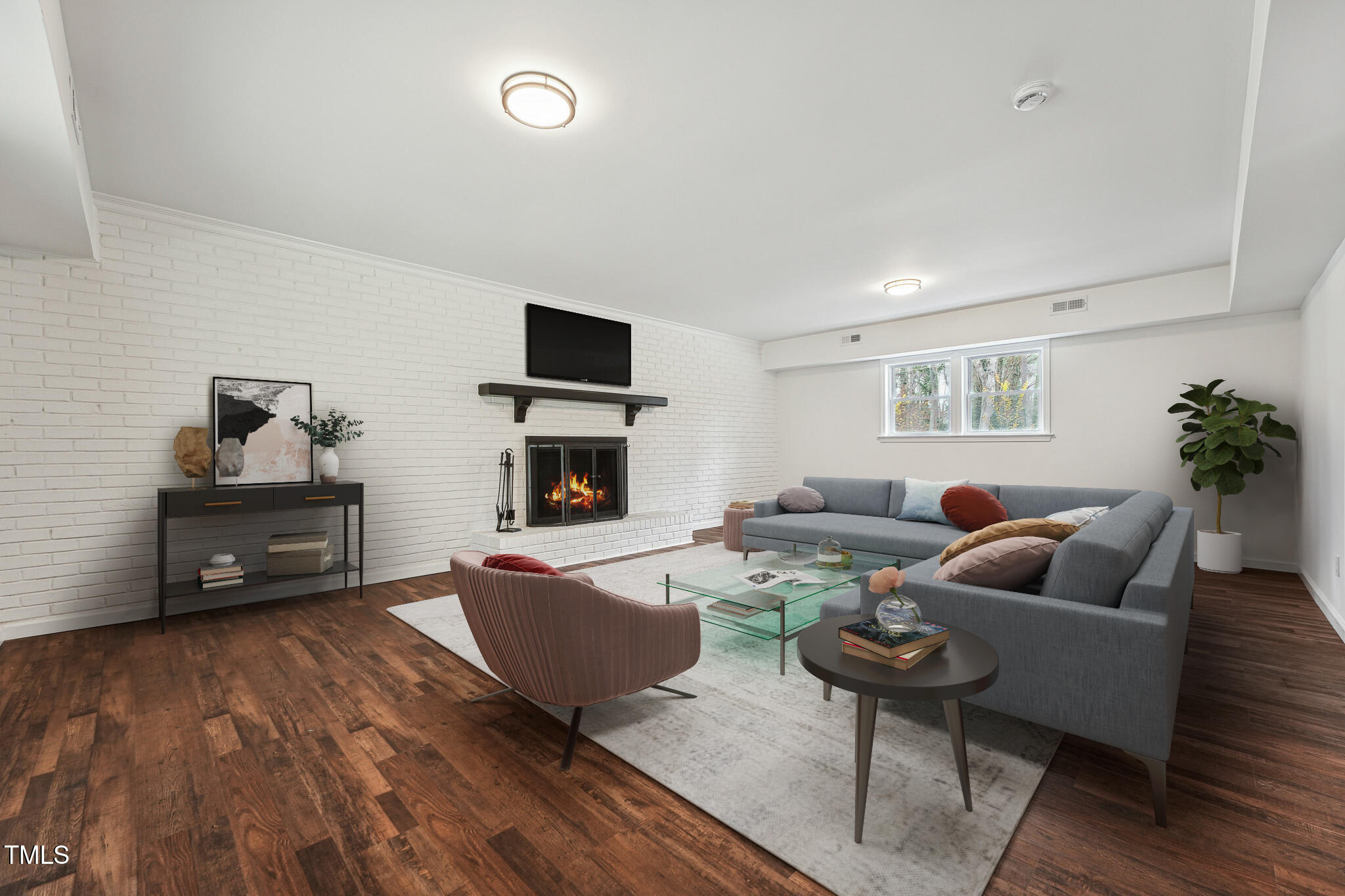 109 Chatterson Drive Raleigh, NC 27615 - Photo 27 of 51 a living room with furniture and a fireplace