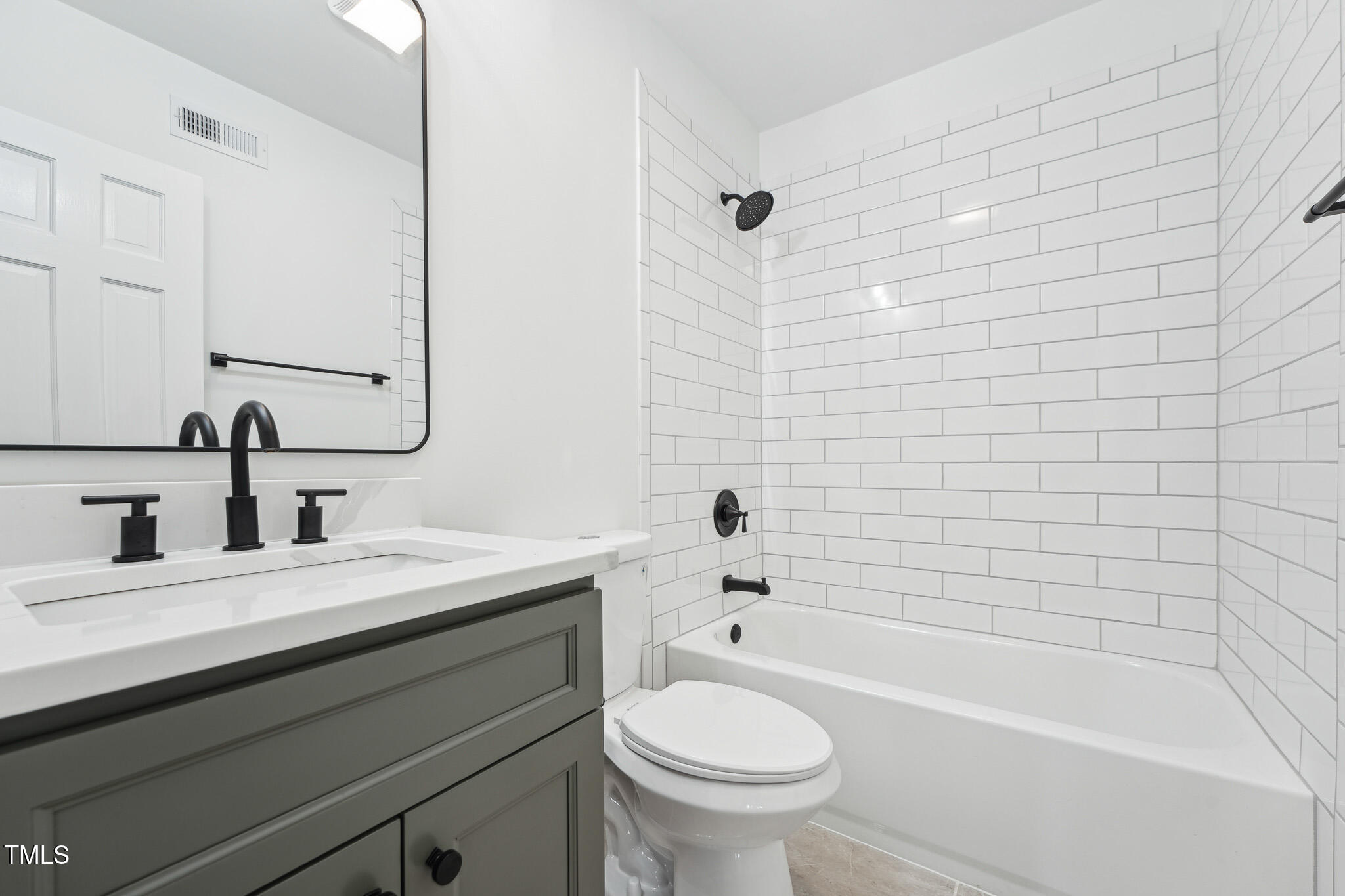 109 Chatterson Drive Raleigh, NC 27615 - Photo 37 of 51 a bathroom with a sink a toilet and bathtub