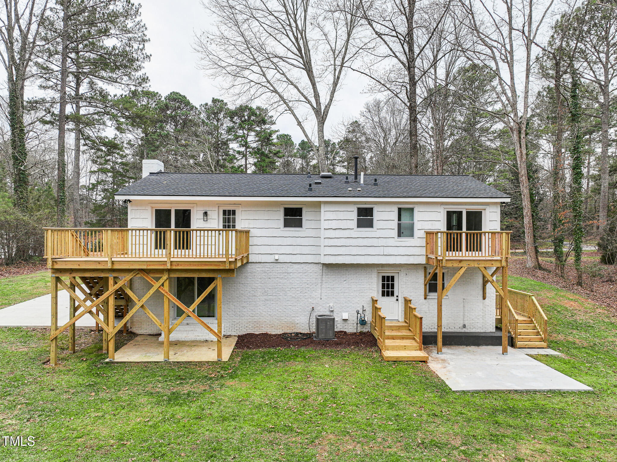 109 Chatterson Drive Raleigh, NC 27615 - Photo 41 of 51 a view of a yard with table and chairs and a slide