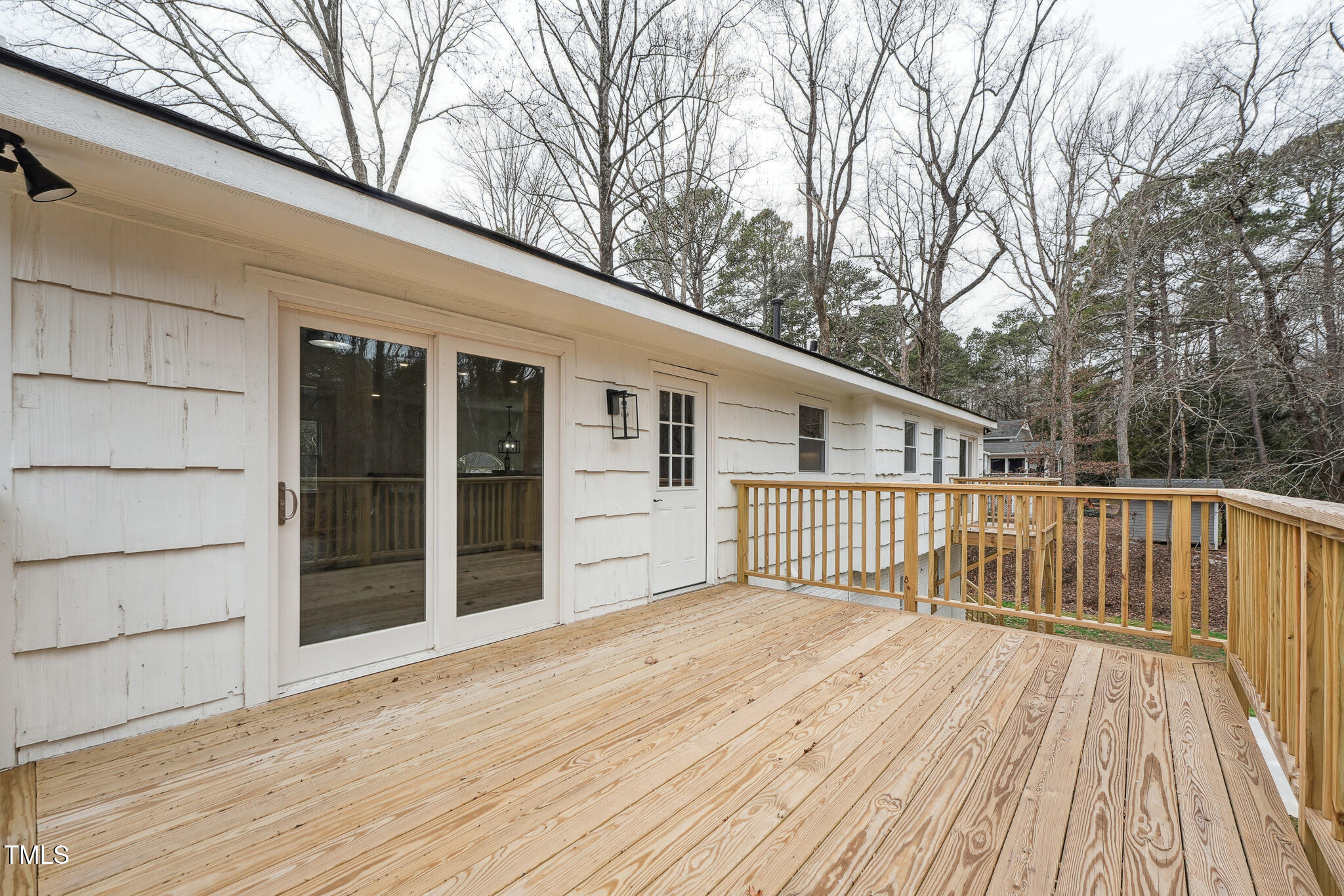 109 Chatterson Drive Raleigh, NC 27615 - Photo 43 of 51 a view of a house with a wooden deck