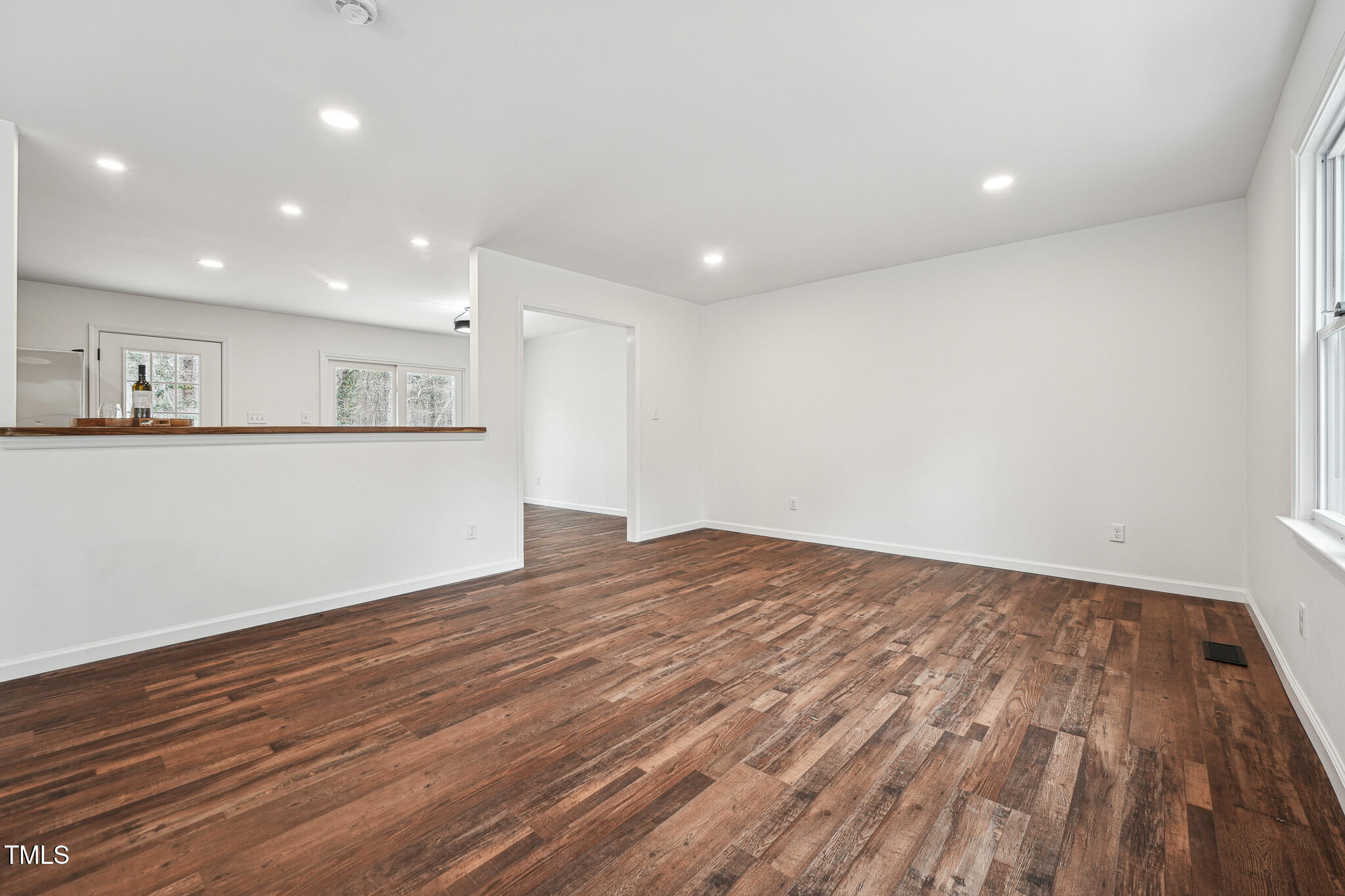 109 Chatterson Drive Raleigh, NC 27615 - Photo 7 of 51 a view of a room with wooden floor and natural light