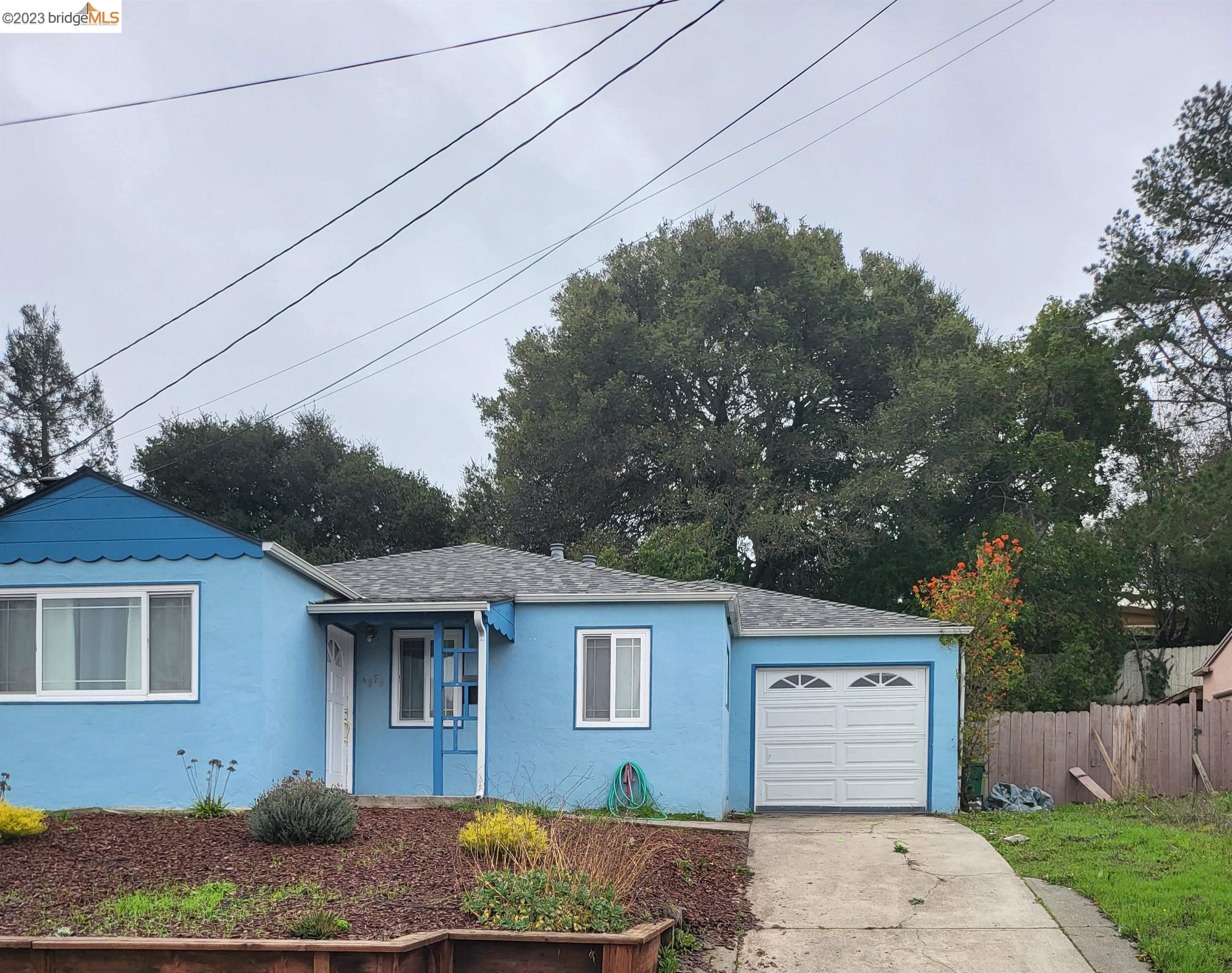4338 Harmon Road El Sobrante, CA 94803 - Photo 1 of 1 a front view of a house with a garden