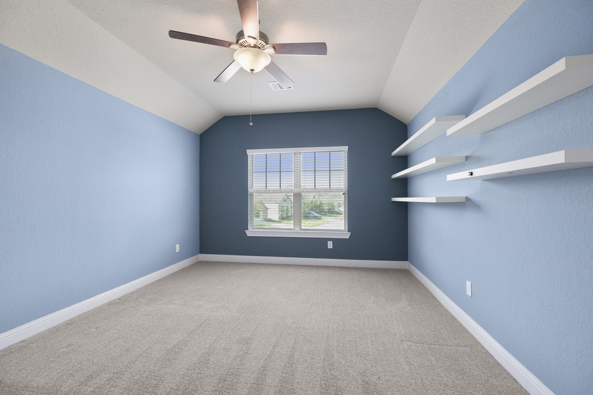 7502 Windsor Park Court Spring, TX 77379 - Photo 32 of 50 an empty room with windows and fan