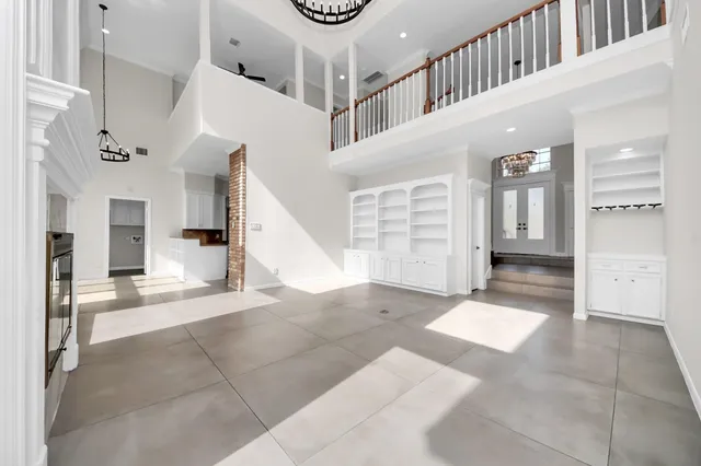 a view of entryway and hall with a front door