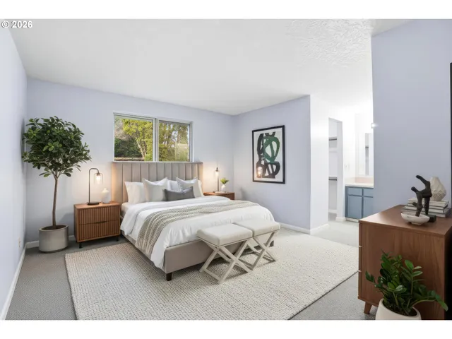 a bedroom with a bed and a couch