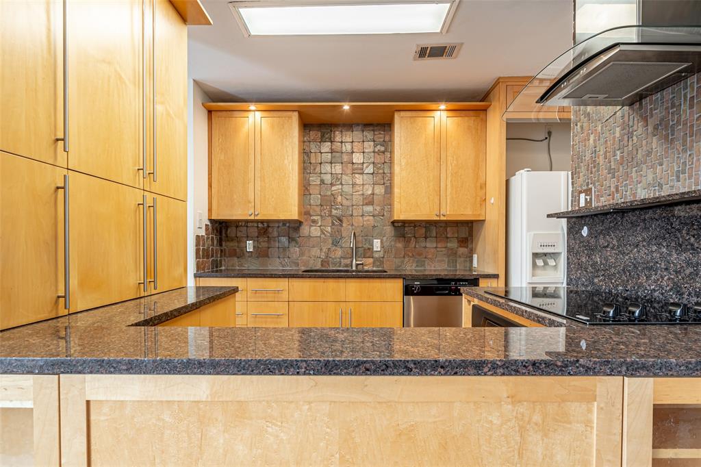 9999 Boat Club Road, Unit 207 Fort Worth, TX 76179 - Photo 6 of 32 Kitchen with tasteful backsplash, light brown cabinetry, wall chimney range hood, and white fridge with ice dispenser