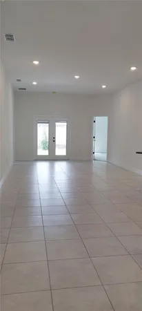 a view of an empty room and window