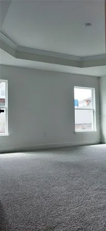 a view of an empty room and a window
