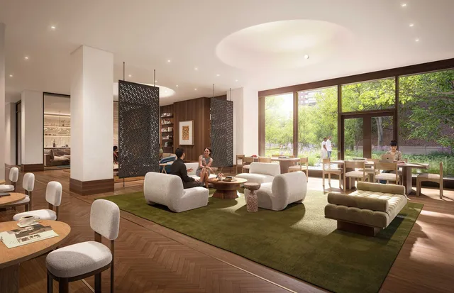 a living room with furniture and floor to ceiling windows