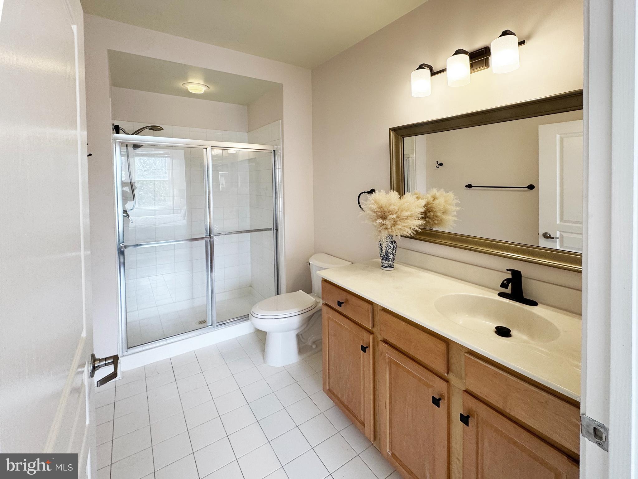 12001 Market Street, Unit 124 Reston, VA 20190 - Photo 14 of 42 With Walk-In Shower