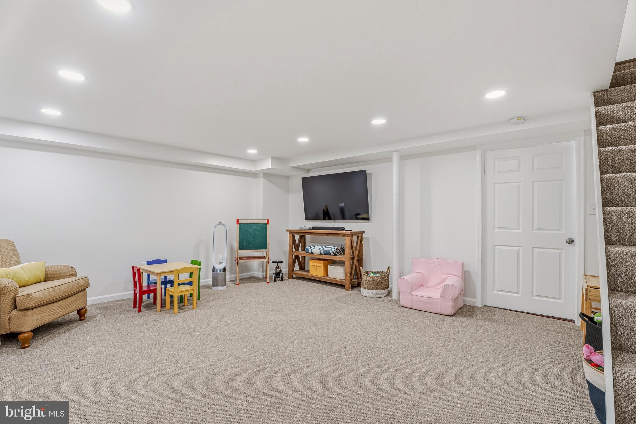 314 Murdock Road Baltimore, MD 21212 - Photo 27 of 42 a living room with furniture and a flat screen tv