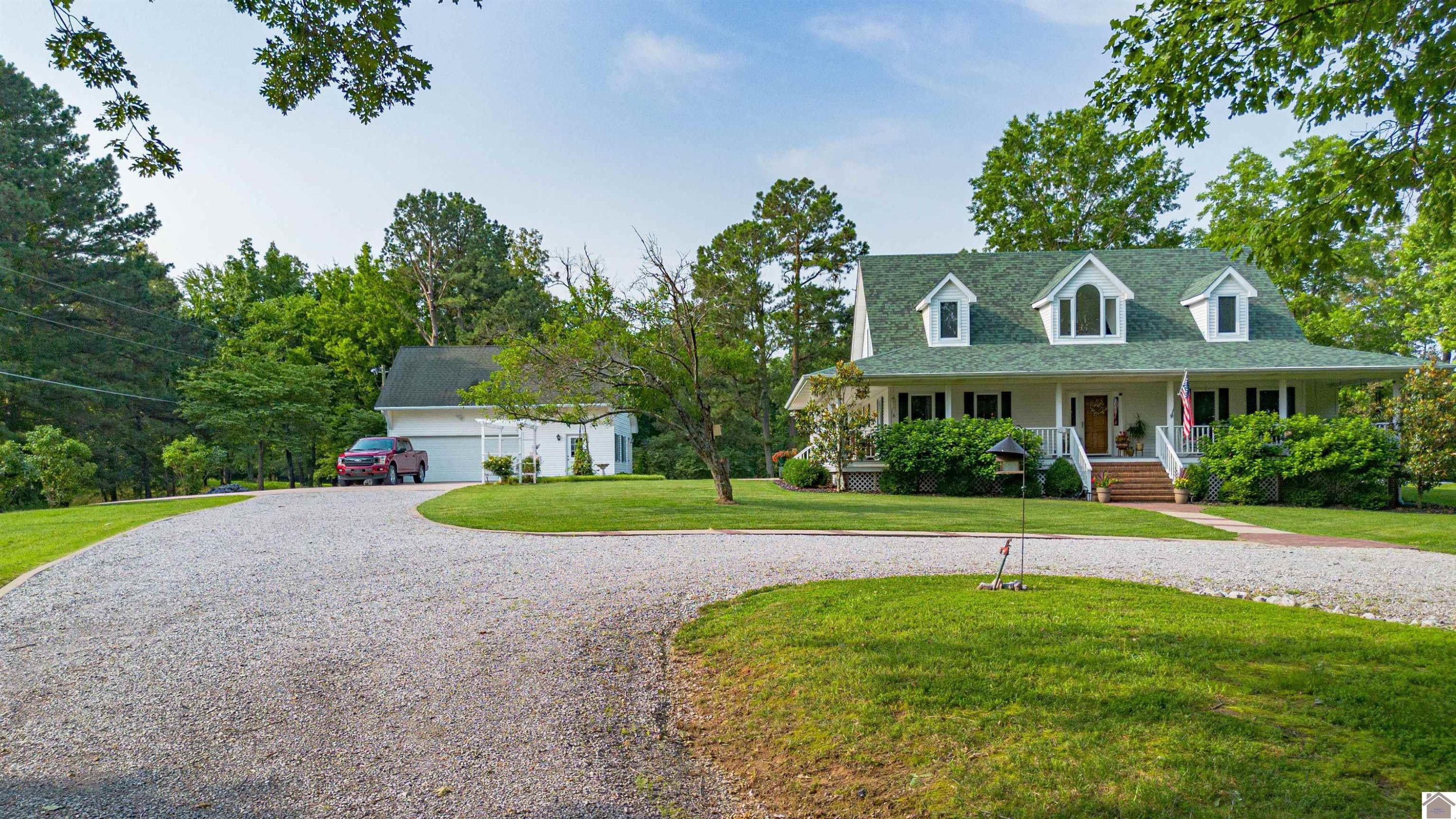 Detached garage with workshop and living space upstairs with a full bath.