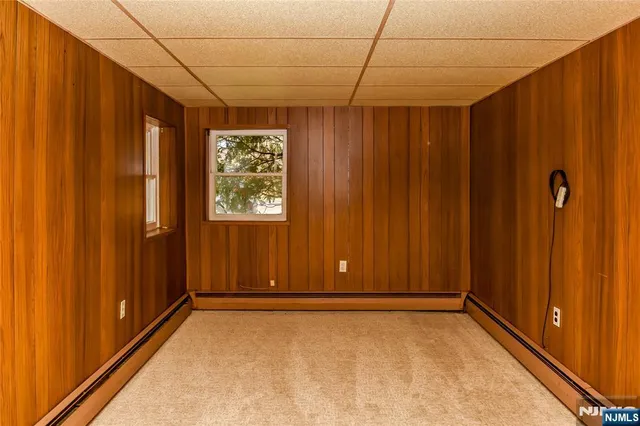 a view of an empty room with wooden door