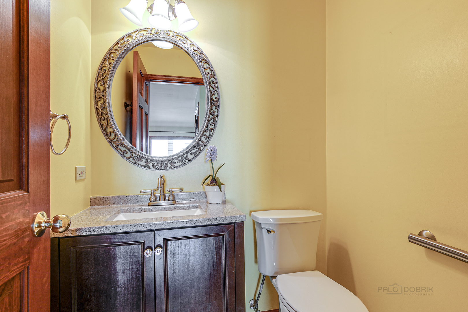 4727 Middle Road Gurnee, IL 60031 - Photo 15 of 29 a bathroom with a granite countertop toilet a sink and a mirror