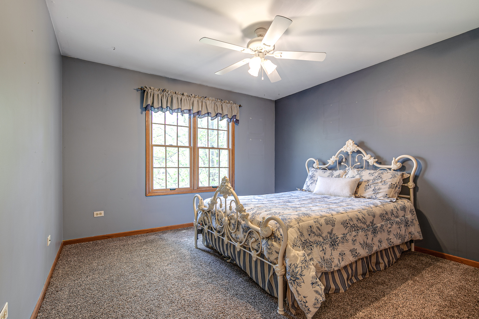 4727 Middle Road Gurnee, IL 60031 - Photo 20 of 29 a bedroom with a bed and a chandelier