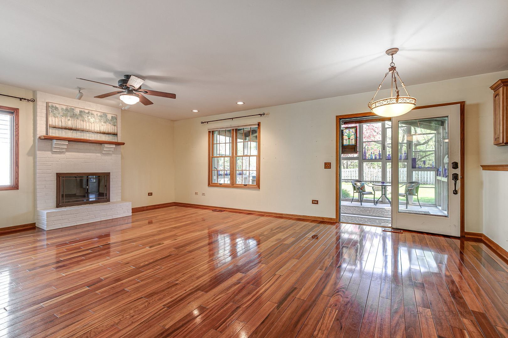 4727 Middle Road Gurnee, IL 60031 - Photo 5 of 29 a view of an empty room with wooden floor fireplace and a window