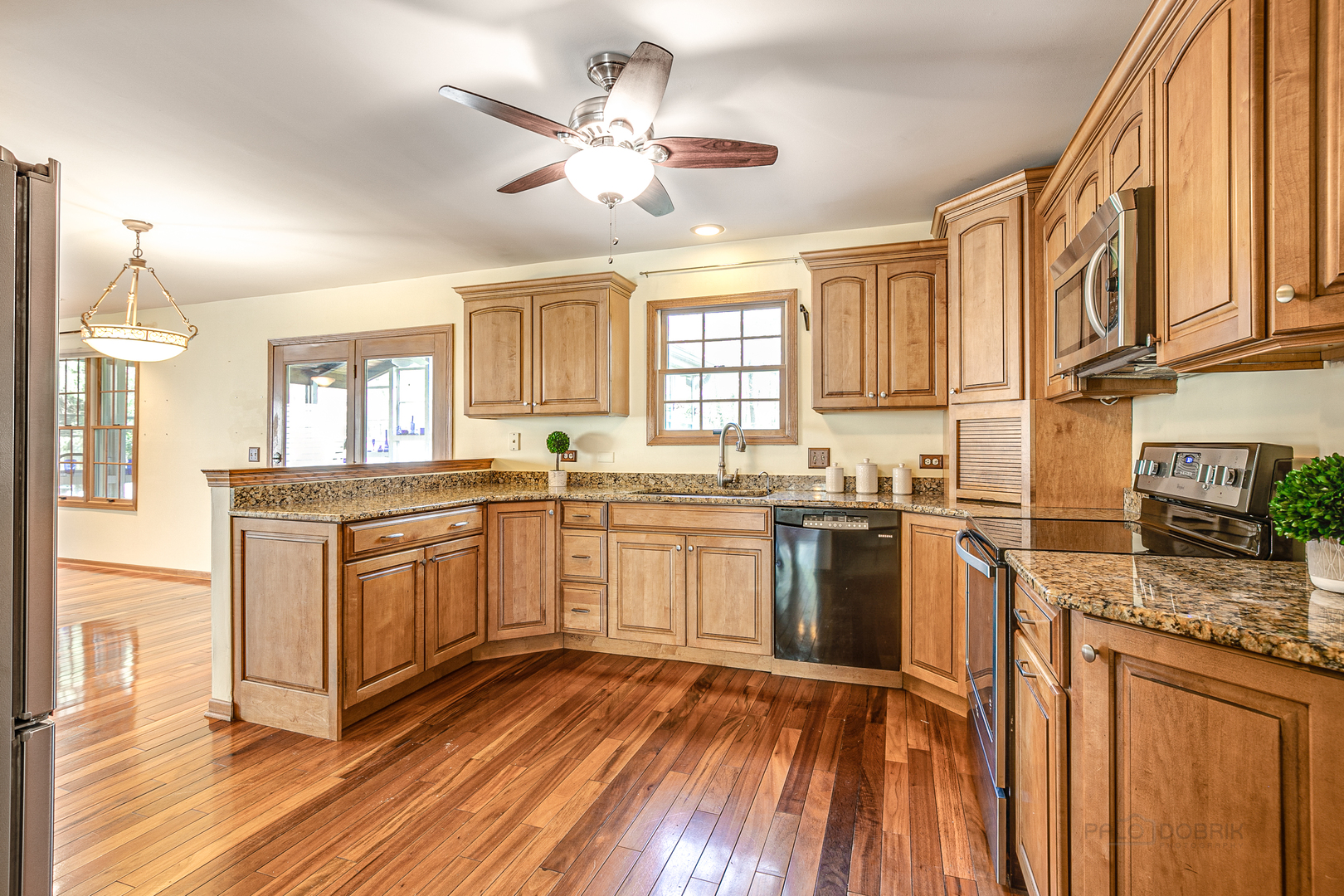 4727 Middle Road Gurnee, IL 60031 - Photo 9 of 29 a kitchen with stainless steel appliances granite countertop a stove and a sink