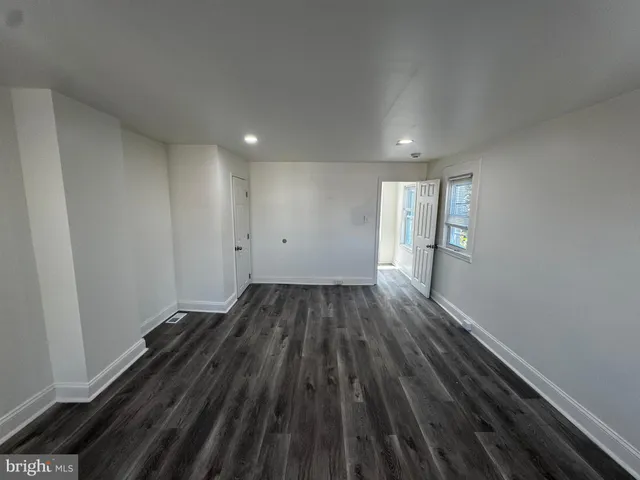 a view of wooden floor and staircase in a room
