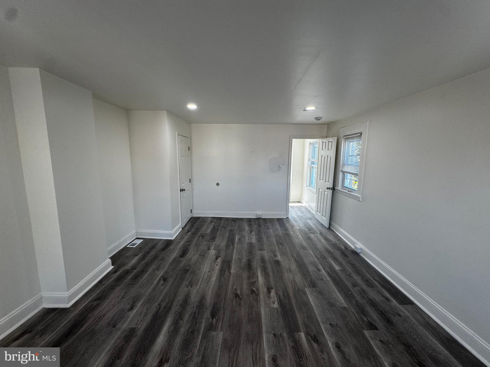 1527 Riggs Avenue Baltimore, MD 21217 - Photo 13 of 16 a view of wooden floor and staircase in a room
