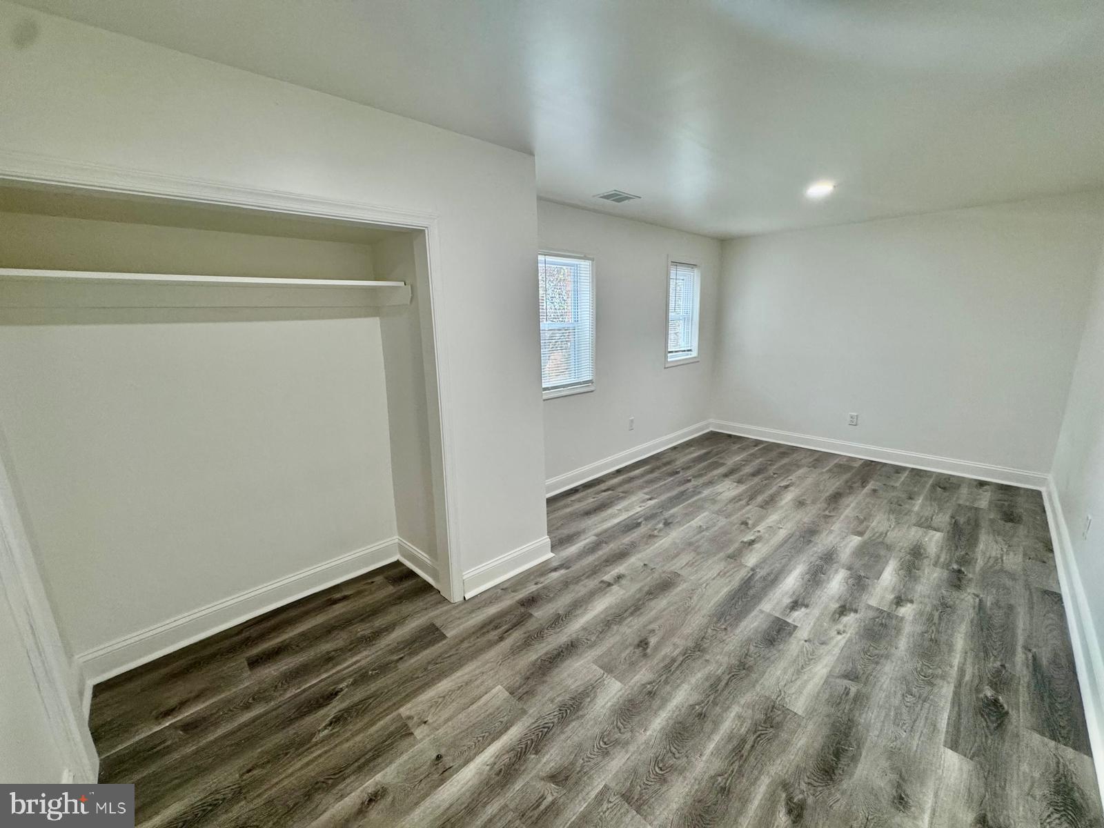 1527 Riggs Avenue Baltimore, MD 21217 - Photo 6 of 16 a view of room with wooden floor and window