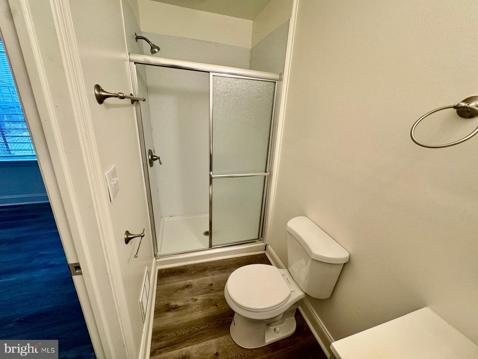 1527 Riggs Avenue Baltimore, MD 21217 - Photo 8 of 16 a white toilet sitting next to a shower