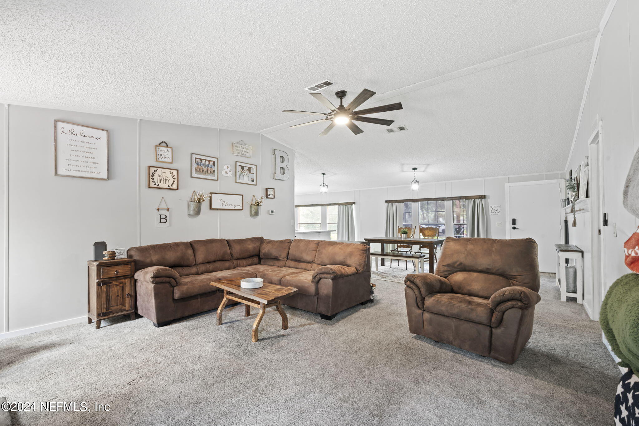 3809 Rancho Road Jacksonville, FL 32221 - Photo 14 of 69 a living room with furniture and a ceiling fan