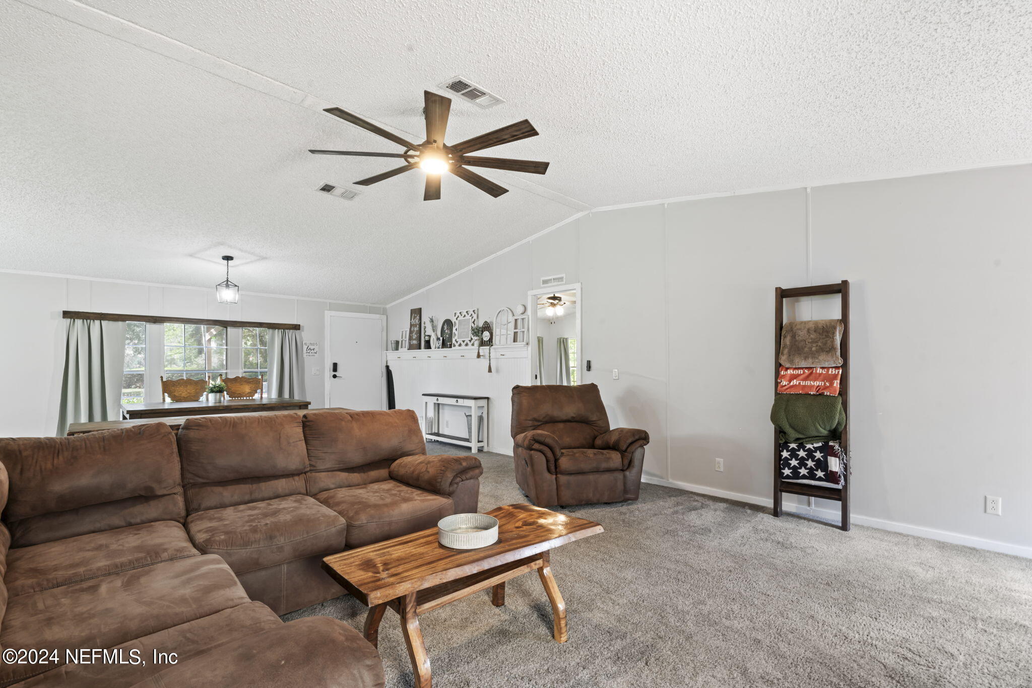 3809 Rancho Road Jacksonville, FL 32221 - Photo 16 of 69 a living room with furniture and a ceiling fan